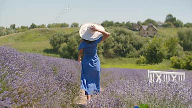 Healthy woman runs joyfully through lavender field