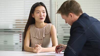Asian businesswoman job applicant talking to hr manager at interview