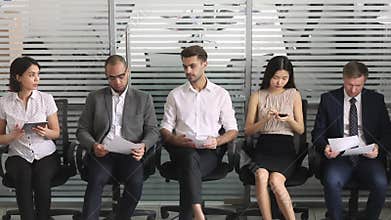 Multicultural business people applicants in row waiting for job interview