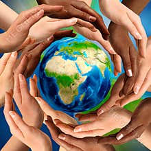 Multiracial Hands Around the Earth Globe