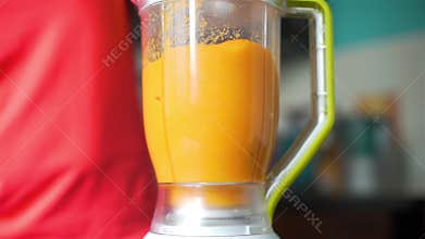 Making vegetable smoothie with blender