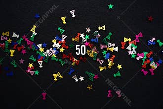 Number 50 and sparkly party hats glitter