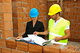 Constructions workers looking on house plans