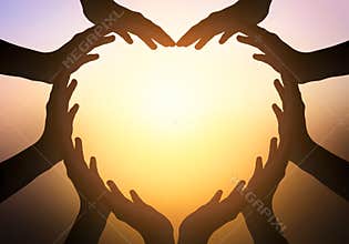 International Day of Friendship concept: hands in shape of heart on blurred background