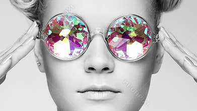 Portrait of beautiful young woman with colored glasses