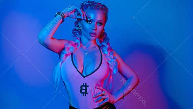 Gorgeous fashionable woman in the lights.blue and red light