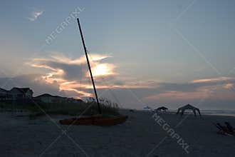 Catamaran on beach, Sunrise