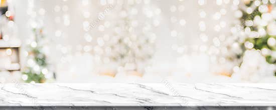 Christmas background of marble table top with abstract warm living room decor with christmas tree string light blur bokeh with