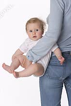 Baby girl is carried by her mum
