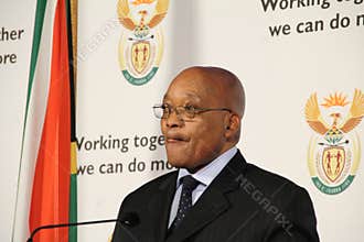 South African President Jacob Zuma licks his lips