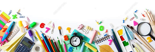 Set of different stationery, alarm clock and supplies on white background. Back to school concept. Banner format. Top view