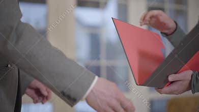 Close-up of unrecognized man sign mortgage contract, put signature on sale purchase rental agreement, handshaking