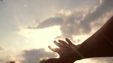 Religion hand concept on blue sky background. The man hand stretches to god faith lifestyle and bliss