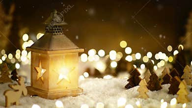 Christmas scene in warm lantern light and snowfall