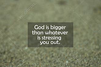 Inspirational motivational quote - God is bigger than whatever is stressing you out. With blurry black sands pattern texture.