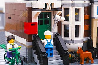 Lego street with painter, dog and girl riding bike