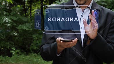 Businessman uses hologram with text Standards
