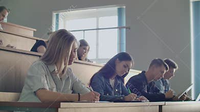 A group of male and female students write a lecture for the Professor. Listen and write the synopsis