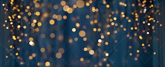Christmas garland lights over dark blue background
