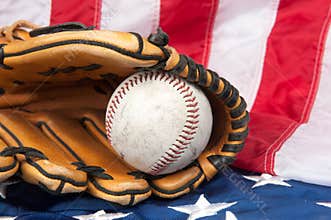 Baseball and glove on American flag