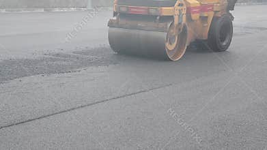 Asphalt paving. Road Construction site. Reconstruction of street. Restoration of pavement. Construction site.. Workers