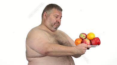 Fat mature man holding plate with healthy food.