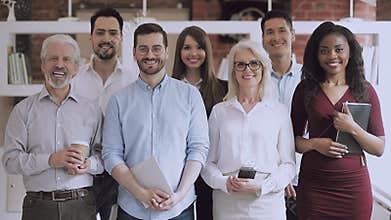 Serious happy professional business team standing in office, video portrait