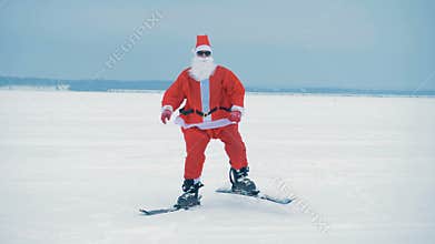 Santa skiing on a snow, close up.