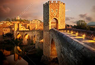 Famous Romanesque Bridge in BesalÃº, Catalonia, Spain during sunset