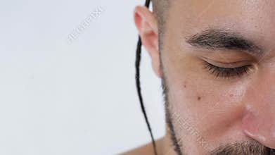 Eyes handsome bearded man looking at camera serious closeup white background 4K.