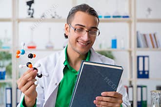 Young male chemist teacher in the lab