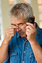 Senior man with phone