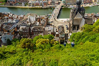 Urban nature: Gondola or cable car ride amid lush green trees in beautiful Dinant city , namur, belgium