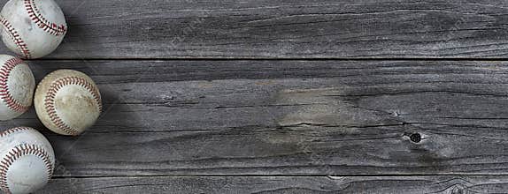 Used baseballs on vintage wooden background. Baseball sports concept with copy space
