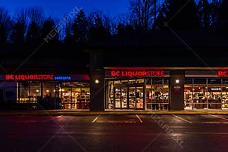 ABBOTSFORD, CANADA - FEBRUARY 10, 2020: bc liquor store retail store strip mall in early morning