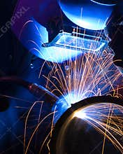 Blue lit MIG welder close