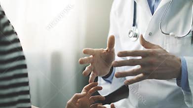 Doctor and patient discussion in clinic office