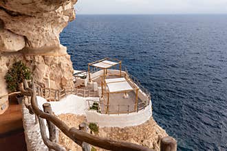 Seaside cafe bar in the caves on the island of Menorca, Spain