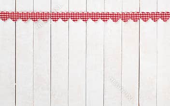 Red and White Valentines Day Hearts in a Row at the top of White Boards Background with copy space below.  It`s a wide horizontal