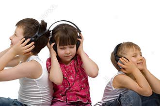 Three Children Listen to Music