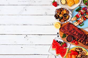 Summer BBQ or picnic food side border, top down view over a white wood background
