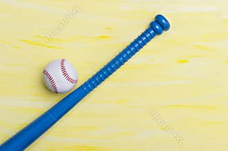 Baseball equipment on yeallow background. Online workout concept