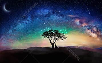 Girl silhouette, meditation under stars, milky way