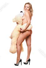 Young woman posing with large teddy bear
