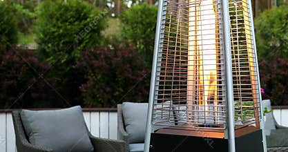 Outdoor gas pyramid heater working on terrace