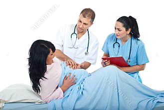 Doctors helping woman in pain