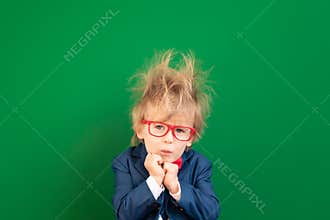 Bright idea! Confusion child student against green chalkboard