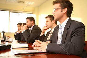 Five professionals at a Conference