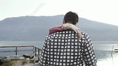 Couple dating and kissing at the lake
