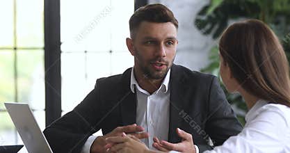 Professional lawyer agent explaining insurance benefits to female client.